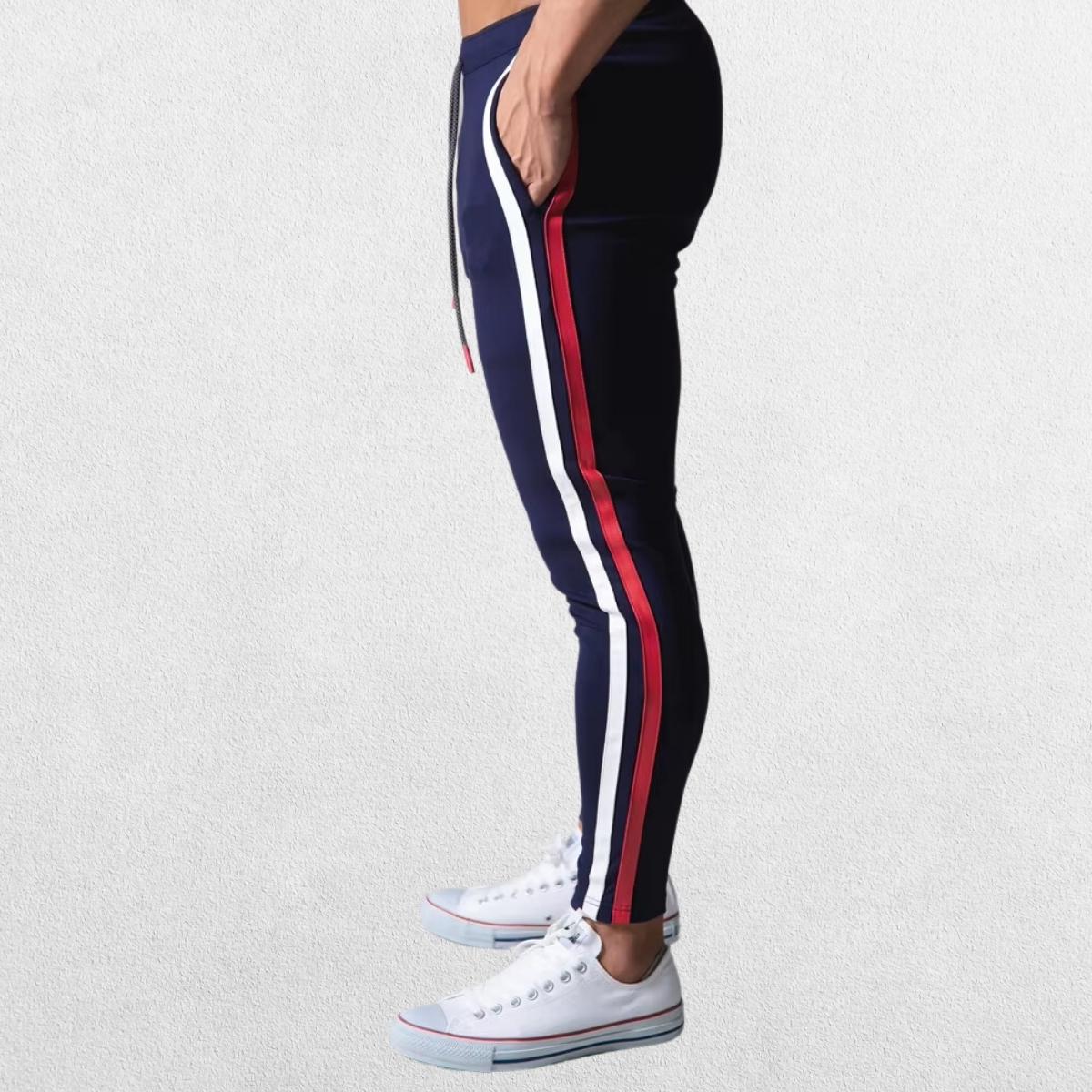 Navy blue Men’s Striped Joggers featuring a sporty stripe design along the leg