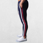 Navy blue Men’s Striped Joggers featuring a sporty stripe design along the leg