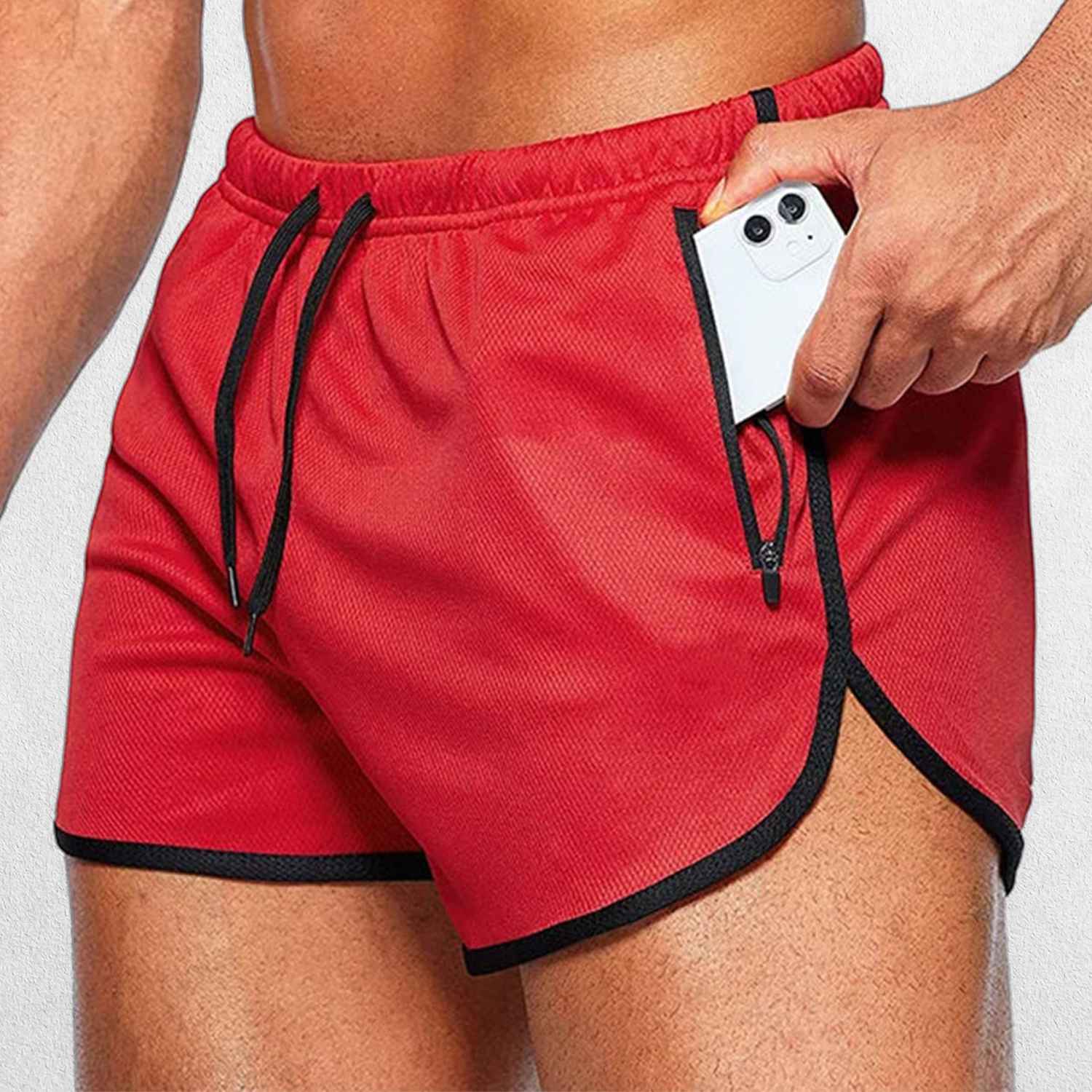 Close-up of Model Wearing Red GPW Men’s Running Shorts showing Zipper pockets for mobiles and other Esentials