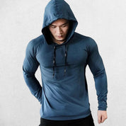 Model wearing Royal Blue men’s slim-fit hooded sports top in action during fitness training.