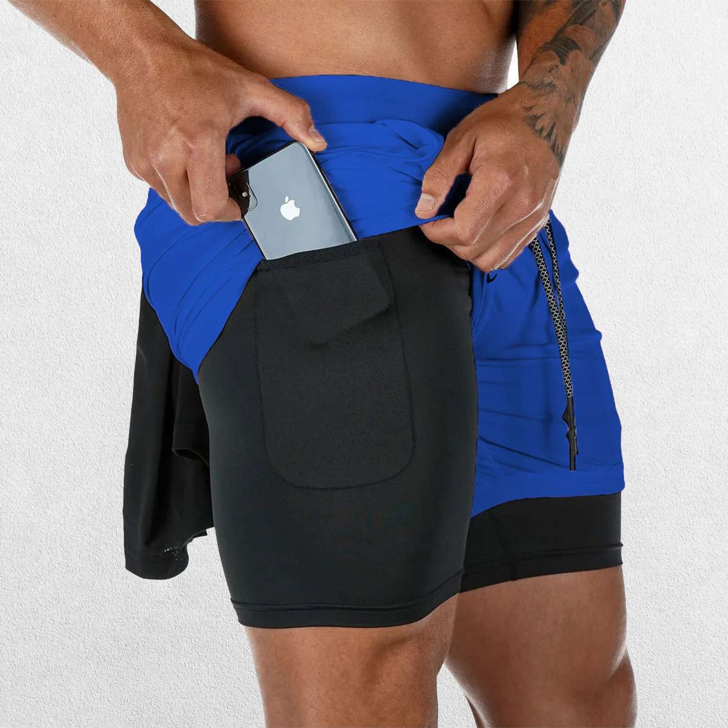 Side Pose Close of Light Blue GPW Men's 2-in-1 Running Shorts Showing mobile pockets 