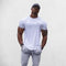 Gym Athlete wearing White Man Printed Quick-Dry Compression Gym T-Shirt – Breathable & Performance-Driven Activewear