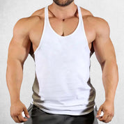 Front View of Model Wearing White Men's Solid Color Cotton Y-Back Sleeveless Tank Tops for Gym Muscle Training & Athletic Workout