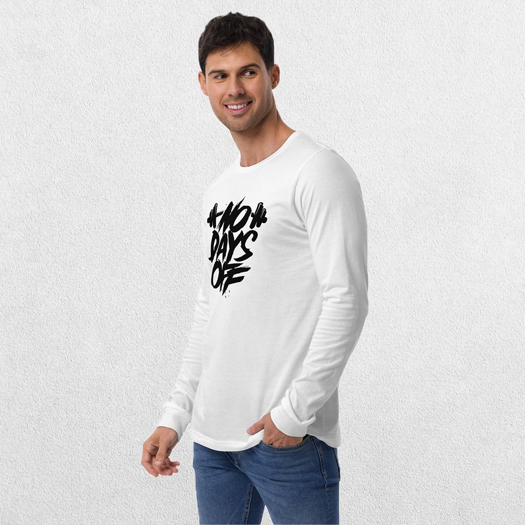 Model wearing the White No Days Off Unisex Long Sleeve Tee - Versatile Athletic and Casual Wear with jeans in studio background